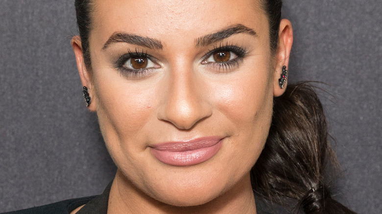 Lea Michele smirks