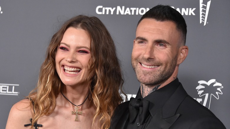 Adam Levine and Behati Prinsloo pose 