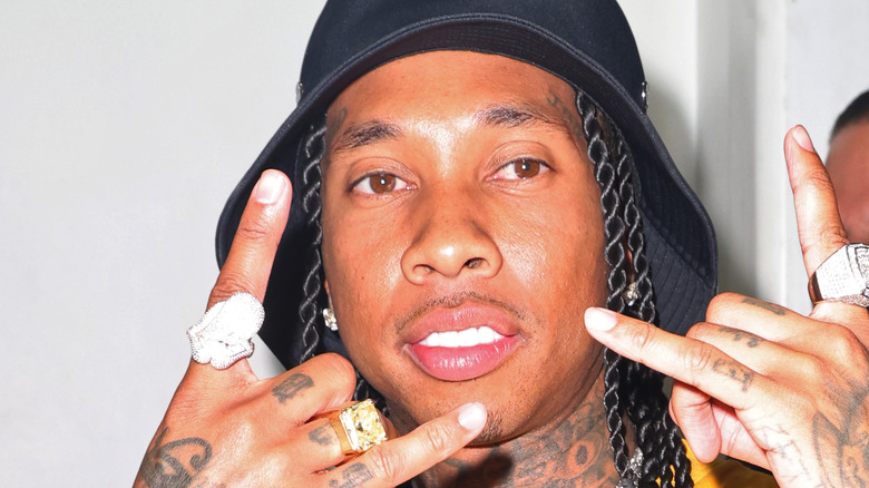 Tyga showcasing diamond rings