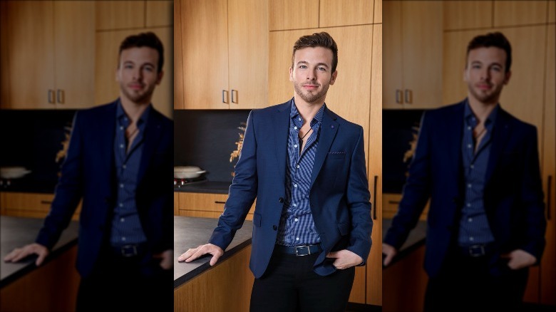 Tyler Whitman posing in kitchen