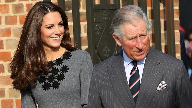 Kate Middleton smiling with King Charles