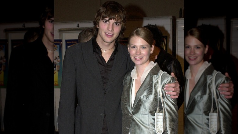 Ashton Kutcher with arm around January Jones