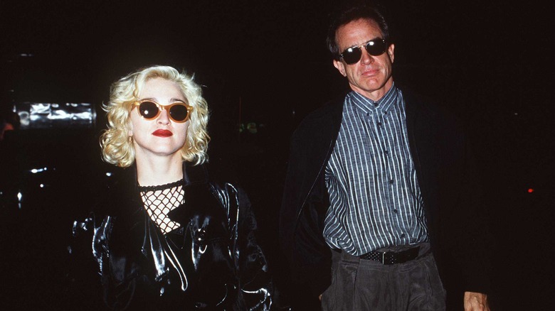 Madonna with Warren Beatty wearing sunglasses