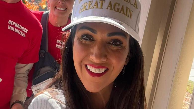 Lauren Boebert wearing a white MAGA hat