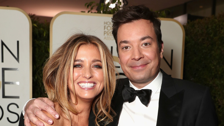 Nancy Juvonen and Jimmy Fallon smiling and posing together