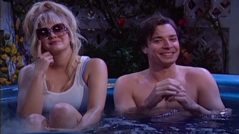 Jimmy Fallon laughing next to Drew Barrymore in a hot tub