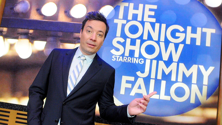 Jimmy Fallon pointing at a sign for "The Tonight Show"