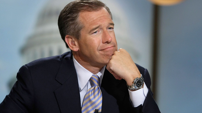 Brian Williams with his chin on his fist
