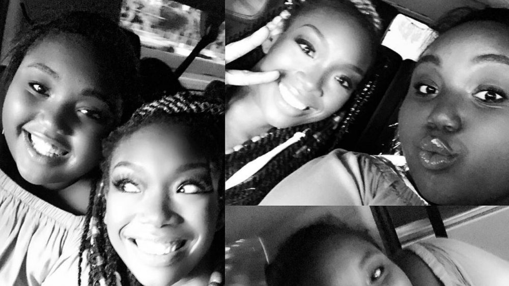 Singer Brandy Norwood poses for selfies with her daughter