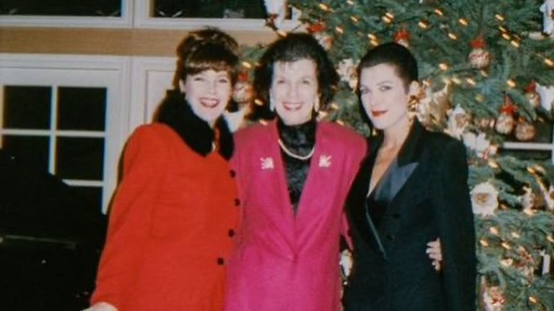 Karen Houghton, Mary Jo Campbell, and Kris Jenner stand near Christmas tree