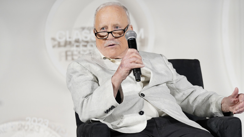 Richard Dreyfuss holding microphone