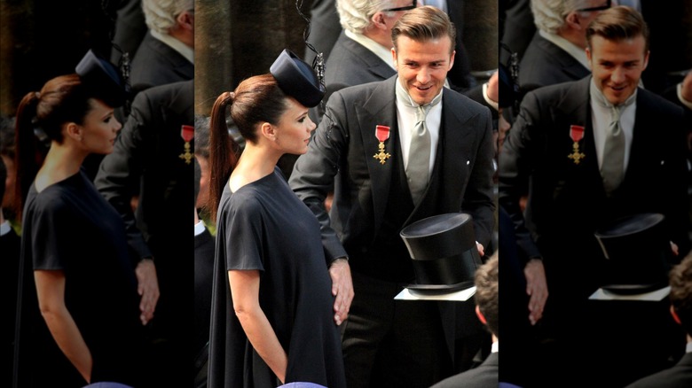 David Beckham placing hand on Victoria Beckham's stomach