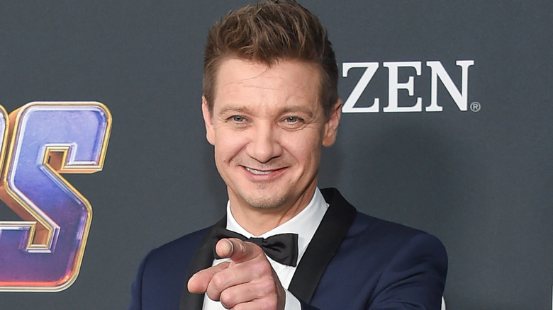 Jeremy Renner pointing and smiling