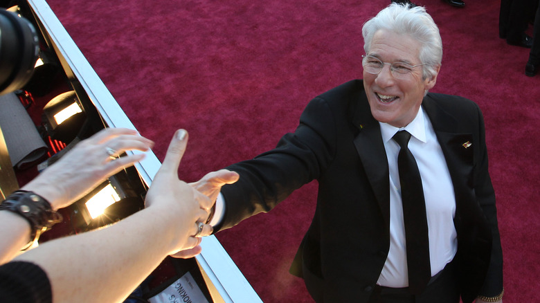 Richard Gere shaking hands at Oscars