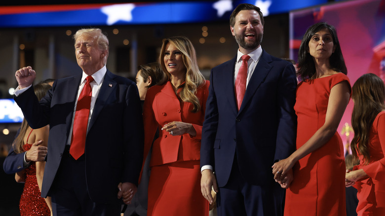 Donald and Melania Trump standing on stage beside JD and Usha Vance