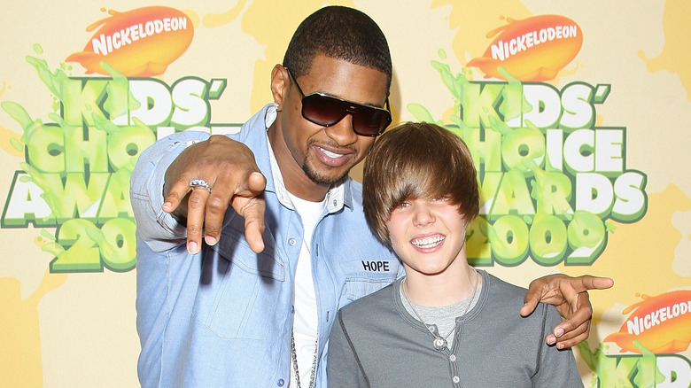 Usher posing with Justin Bieber