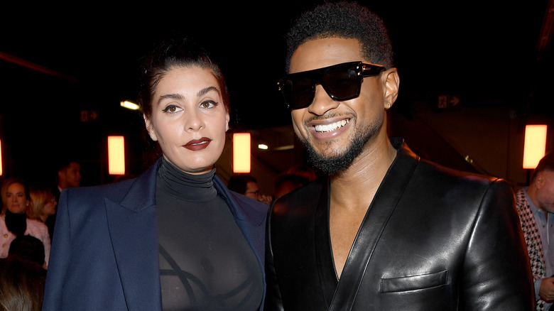 Usher and Jenn Goicoechea smiling