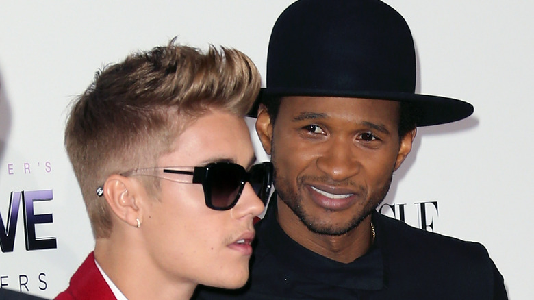 usher and justin bieber on the red carpet 