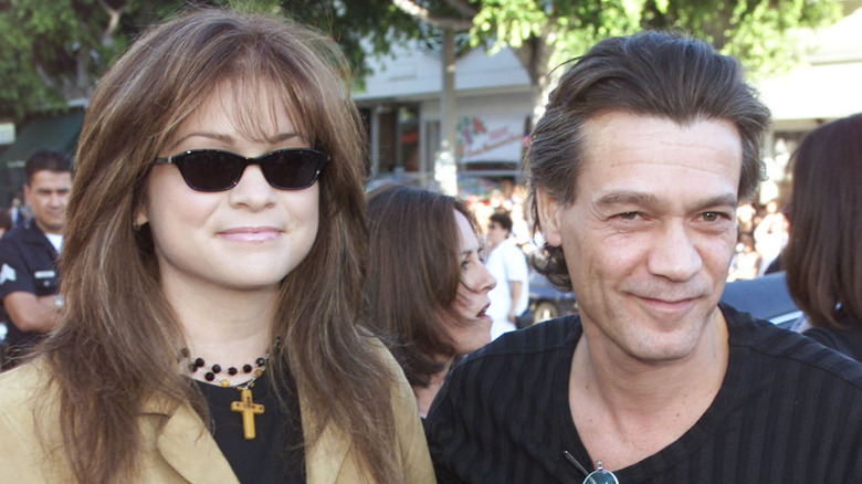 Valerie Bertinelli and Eddie Van Halen smiling and walking