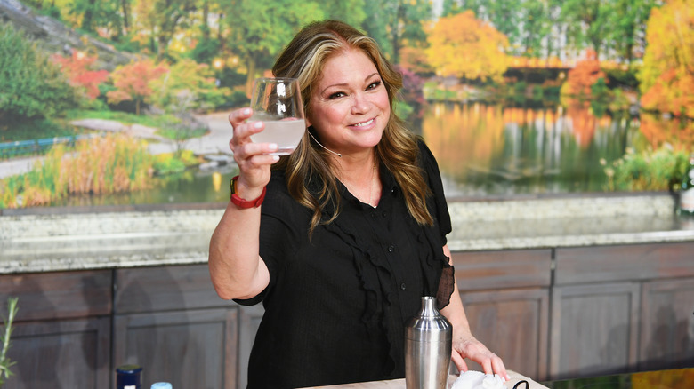 Valerie Bertinelli raising a glass and smiling