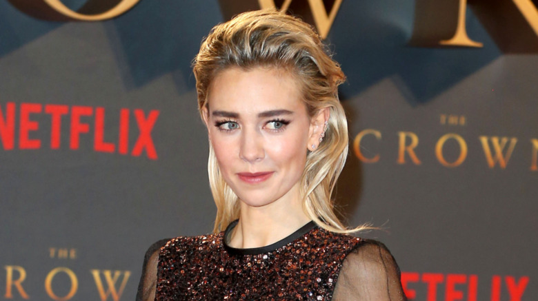 Vanessa Kirby posing for cameras, smiling and looking sideways to her left