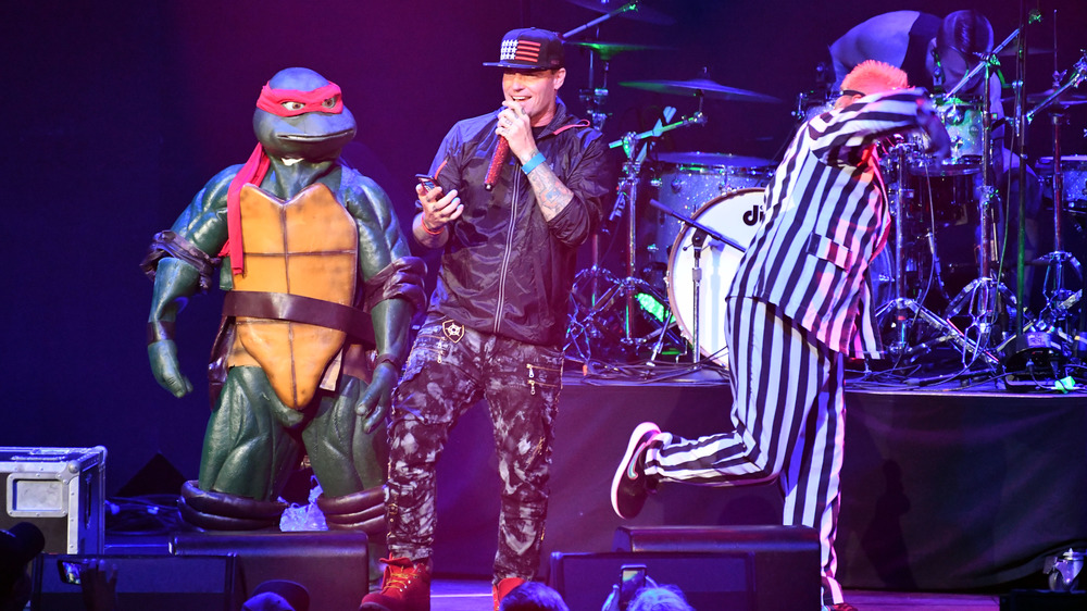 Vanilla Ice on stage with a Ninja Turtle