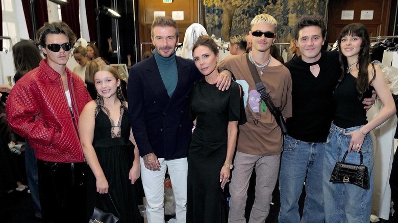 Beckham family and Nicola Peltz posing