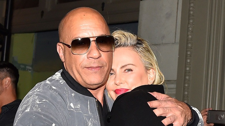 Vin Diesel and Charlize Theron hug at a 2021 event