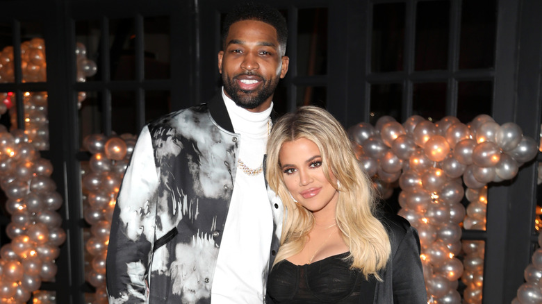 Khloe Kardashian and Tristan Thompson pose together at event