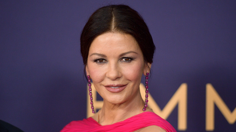 Catherine Zeta-Jones poses in a pink dress