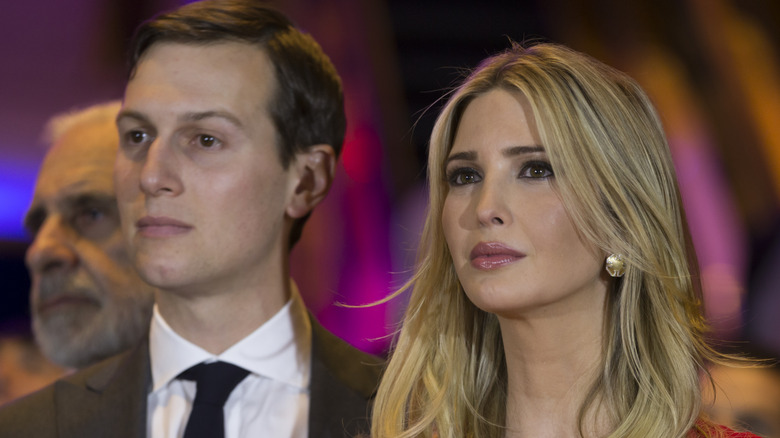 Jared Kushner and Ivanka Trump standing at an event 