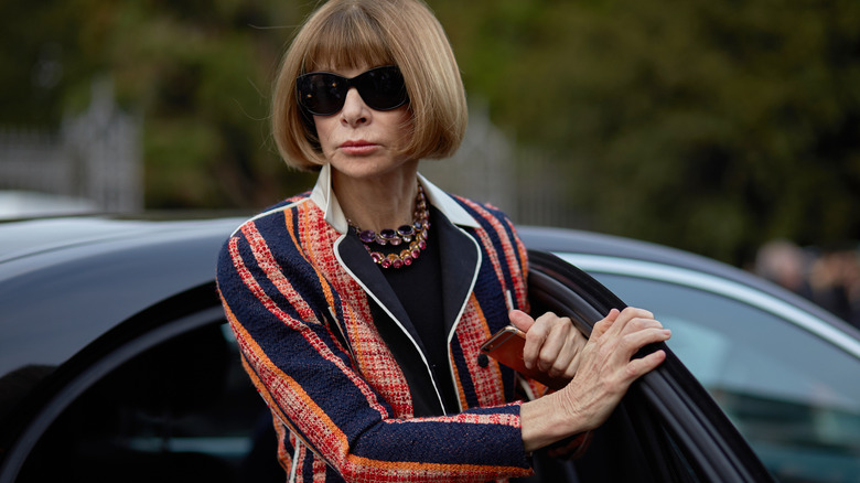 Anna Wintour getting out of a car 