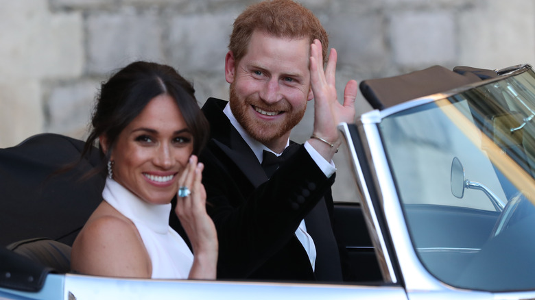 Prince Harry and Meghan Markle waving