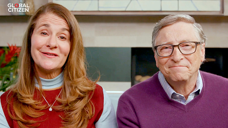 Melinda Gates speaking next to Bill Gates