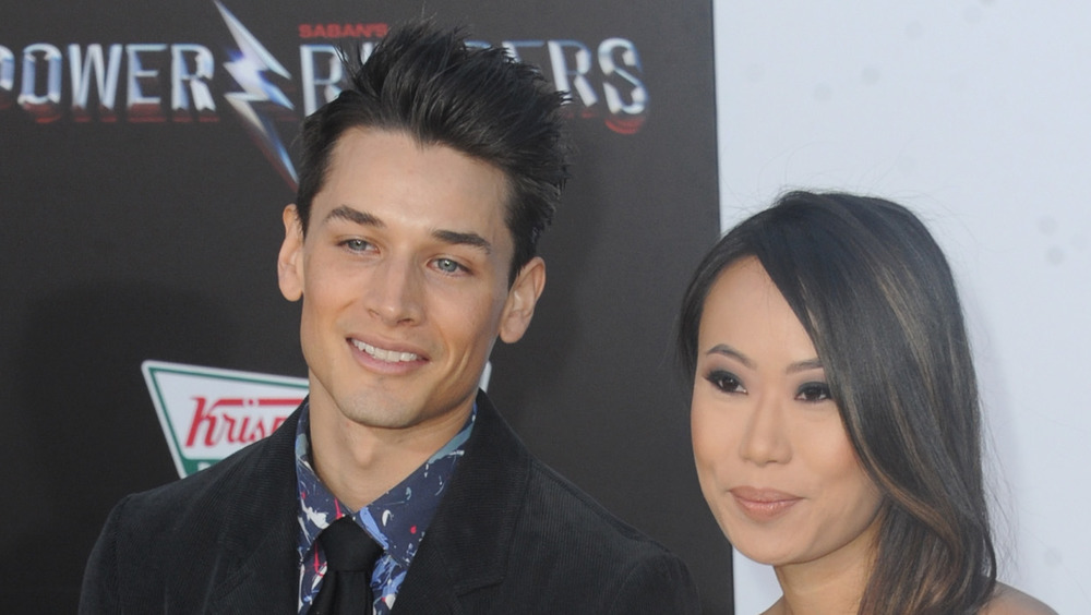 Andrew Gray and Kelly Mi Li on a Power Rangers red carpet