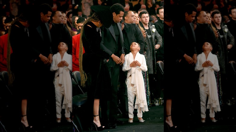 Blue Ivy looking up at Jay-Z