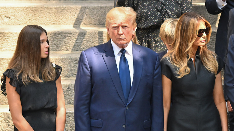 Kai stands next to Trump and Melania Trump