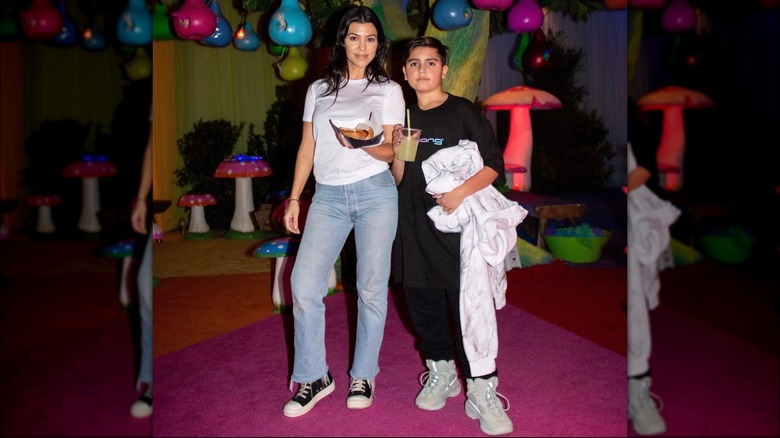 Kourtney Kardashian, Mason Disick with hot dog and drink