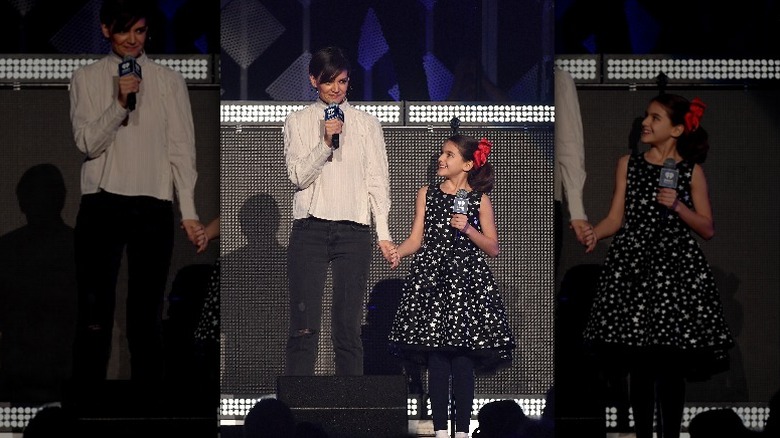 Katie Holmes and Suri hold hands