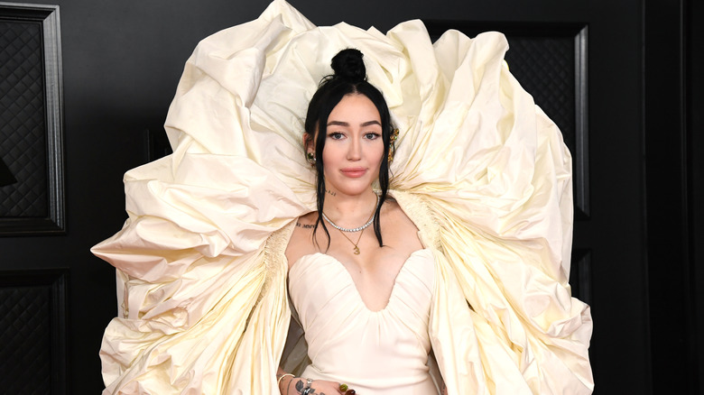 Noah Cyrus wearing white dress