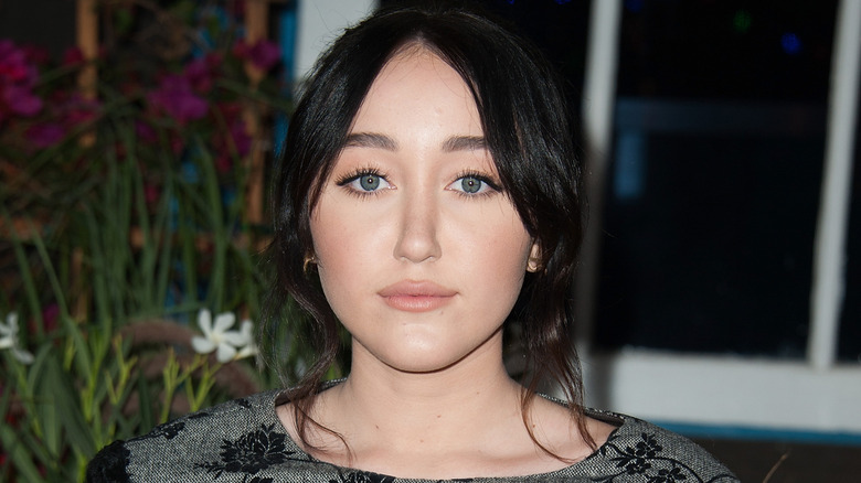 Noah Cyrus with a neutral expression