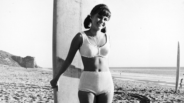 Sally Field smiling on the beach as Gidget