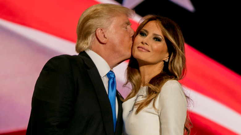 Donald Trump kissing Melania Trump on the cheek