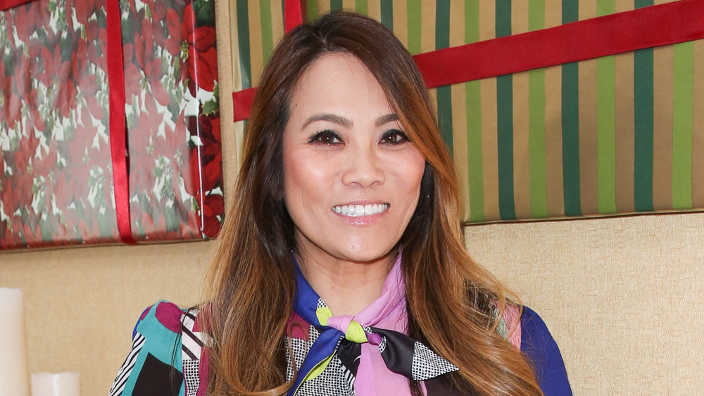 Dr. Sandra Lee, aka Dr. Pimple Popper, smiling at an event in 2018