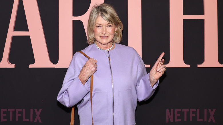 Martha Stewart wearing purple coat at the premiere of Netflix's "Martha" documentary