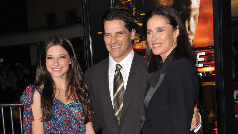 Mimi Rogers with her daughter and husband in 2010