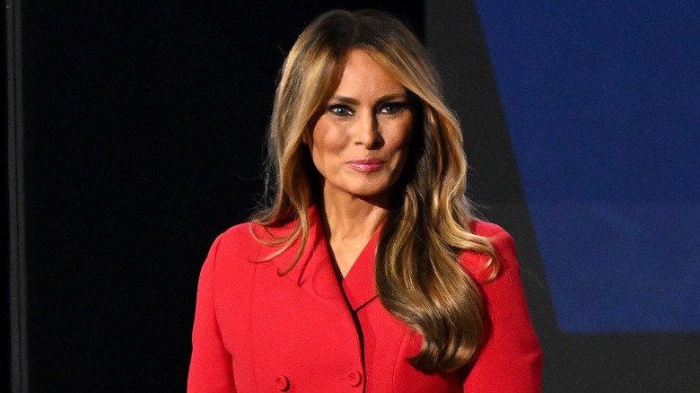 Melania Trump wearing a red suit