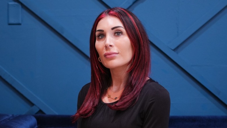 Laura Loomer with red hair smiling