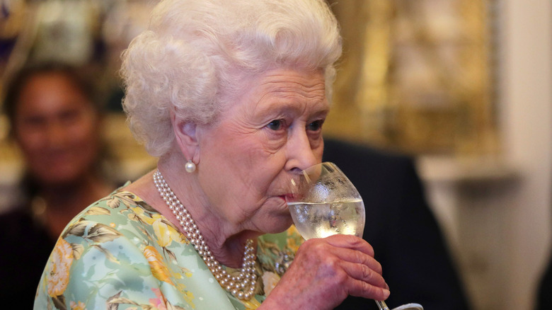 Queen Elizabeth II drinking