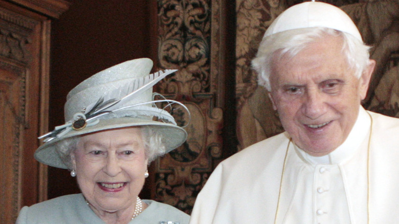 Queen Elizabeth and the Pope smiling